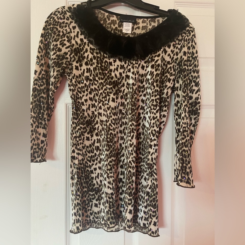 Be the sparkle of the party with this beautiful top by Brittany Black.